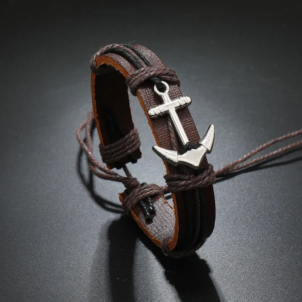 A leather anchor bracelet featuring a silver anchor charm, combining elegance and nautical style in a unique accessory.