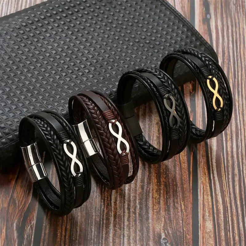 Five distinct leather bracelets featuring an infinity symbol, showcasing various styles and textures in a cohesive display.