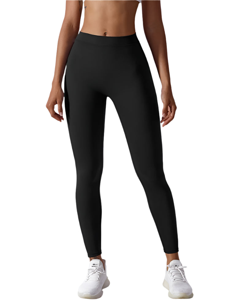 Person wearing black leggings on a white background
