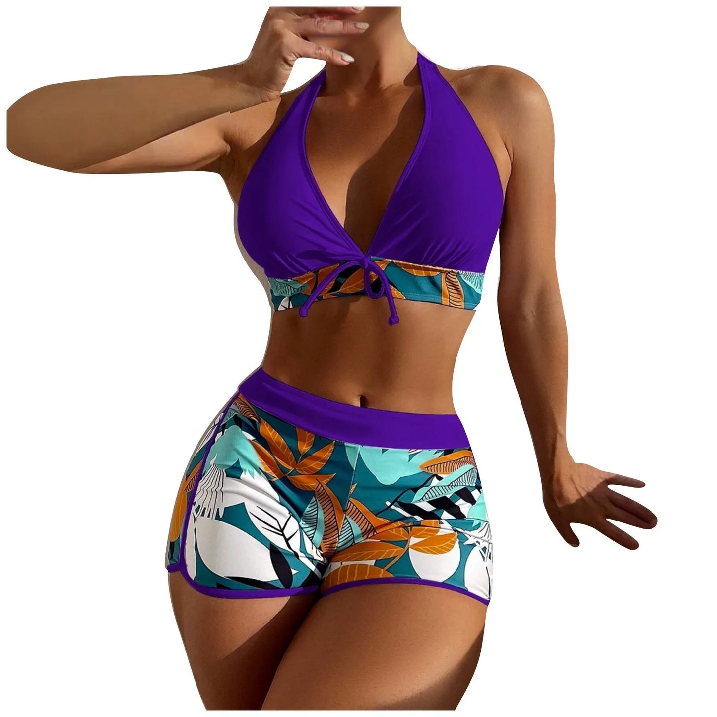 Woman wearing a colorful High Waist Plant Print Bikini Set with a purple top and leaf-patterned bottom on a white background