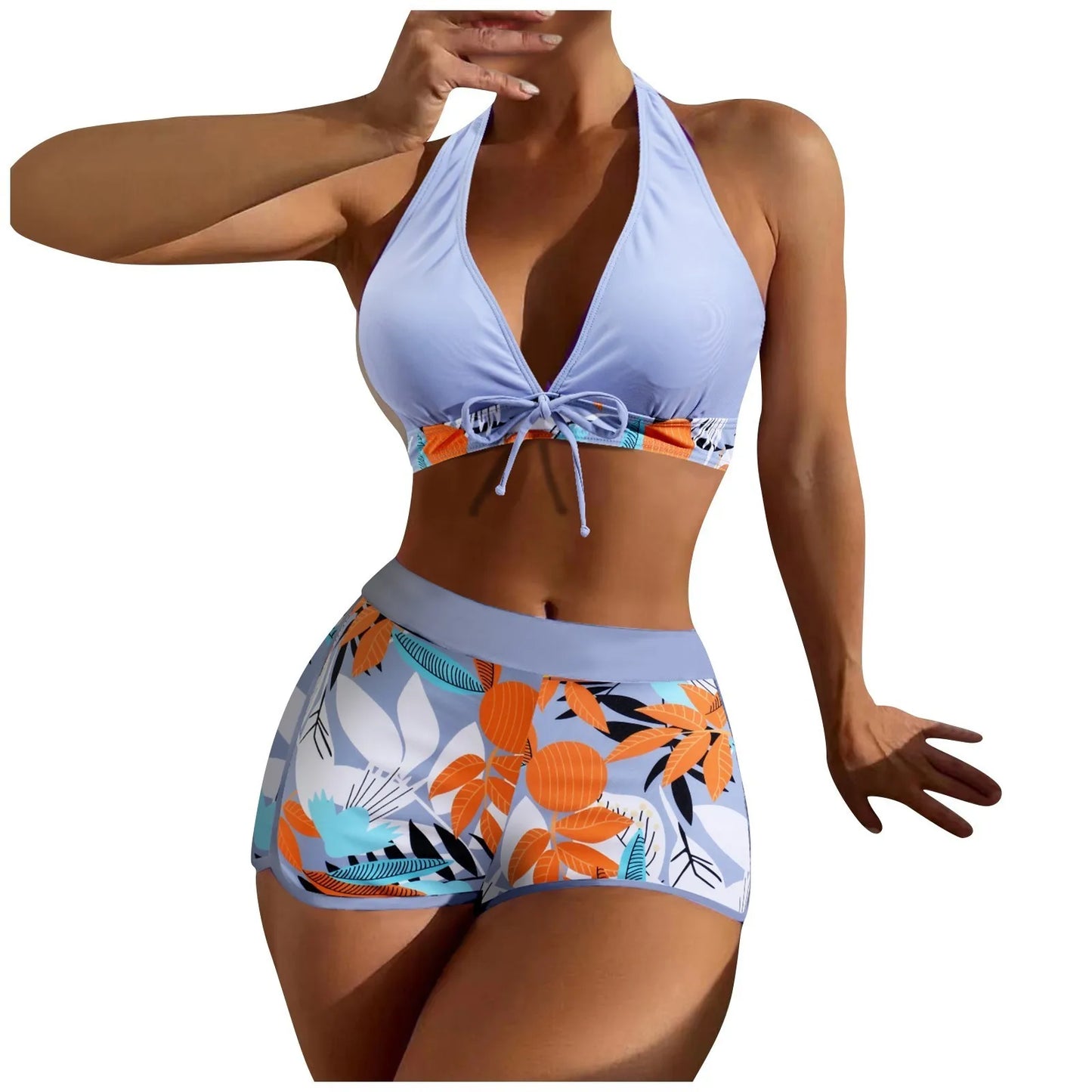 Woman wearing a light blueHigh Waist Plant Print Bikini Set with floral patterned bottom on a white background
