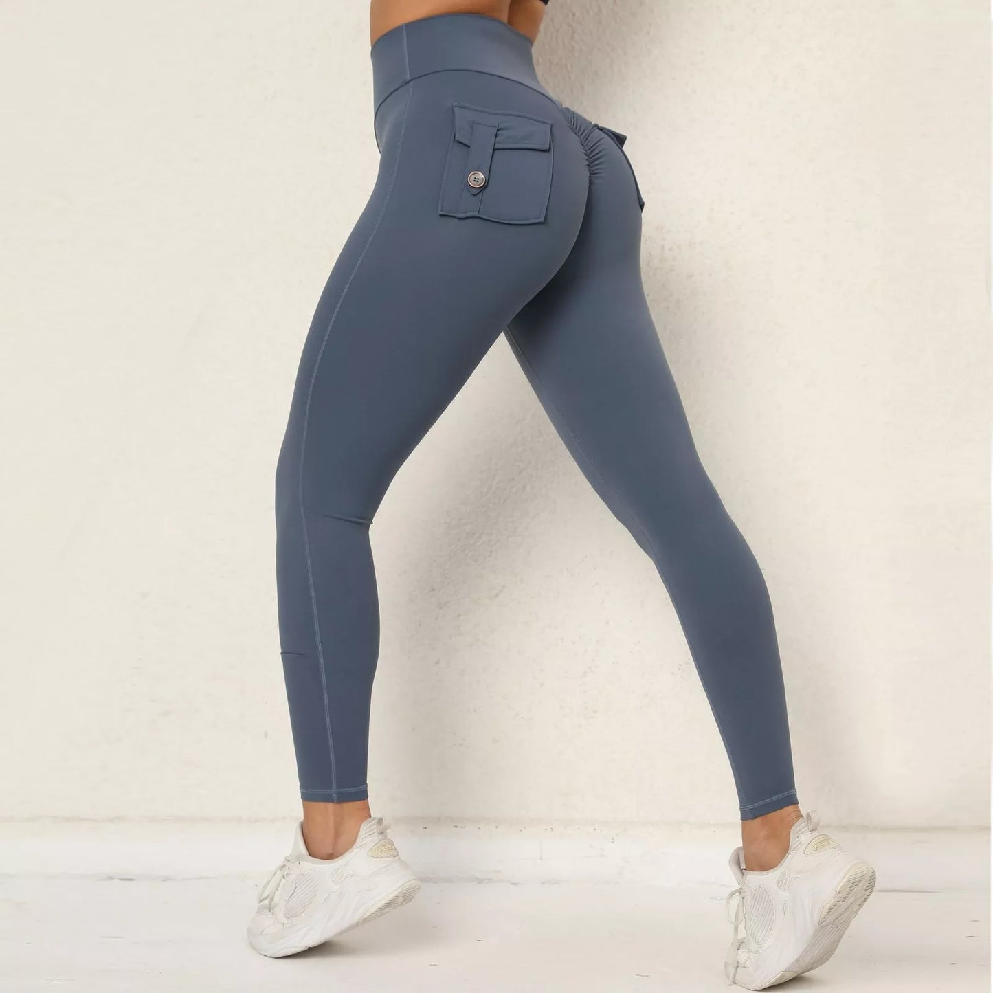 Blue leggings with a pocket on a white background
