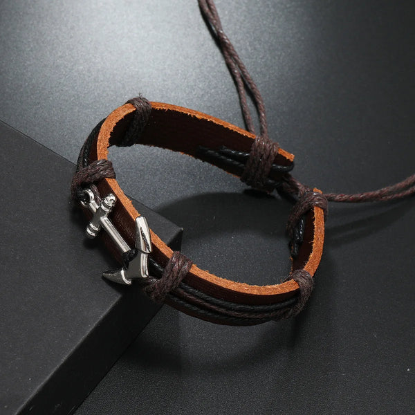 A brown leather anchor bracelet, showcasing a stylish and rugged design suitable for casual wear.
