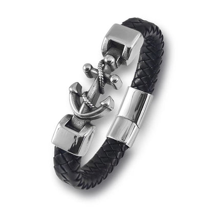 A chic black leather bracelet adorned with a polished silver anchor, blending elegance with a maritime touch.