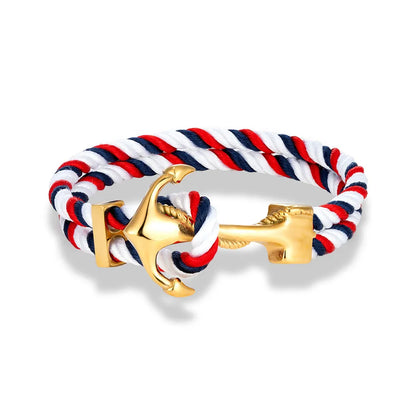 A red, white, and blue rope bracelet featuring a silver anchor charm, symbolizing nautical themes and patriotism.