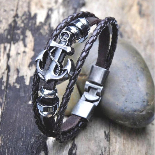 A stylish leather bracelet featuring a metal anchor and a secure clasp, perfect for nautical-themed accessories.