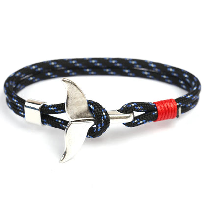 A stylish black and red rope bracelet featuring a sleek silver anchor charm, perfect for nautical-themed accessories.