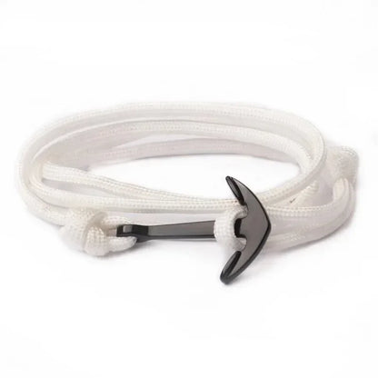 A stylish white rope bracelet featuring a silver anchor charm, perfect for nautical-themed accessories.