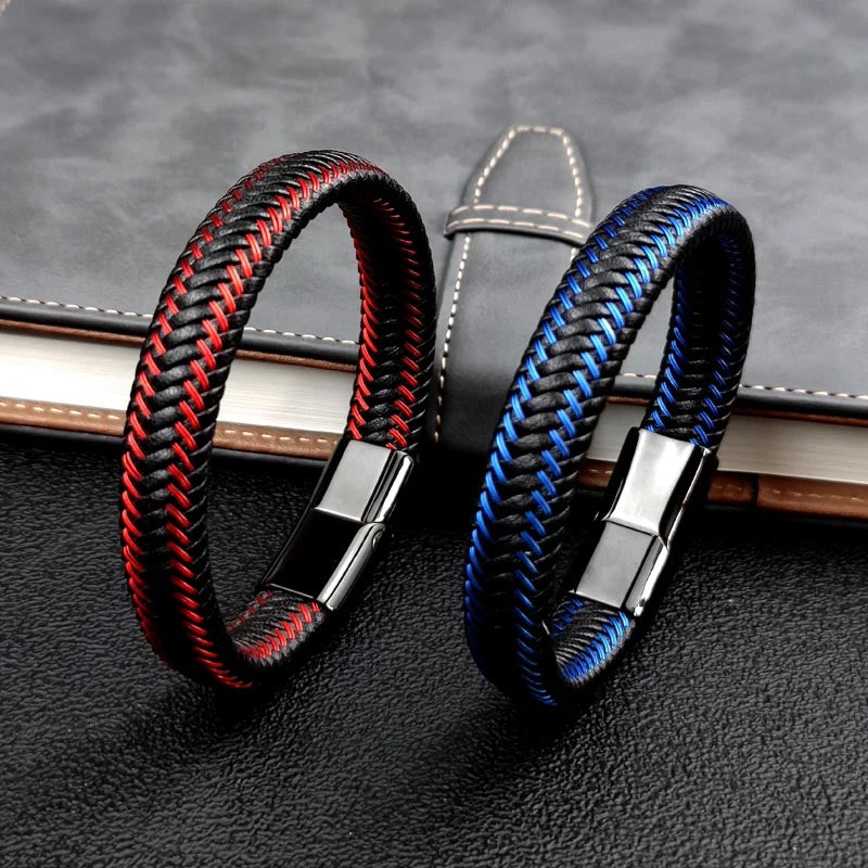  A pair of leather bracelets, one in black and the other in red, showcasing a stylish braided pattern.