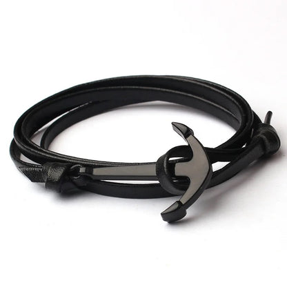 A stylish black leather bracelet featuring a silver anchor charm, perfect for nautical-themed accessories.