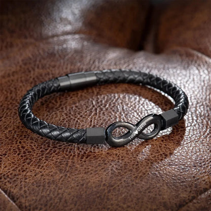 A black leather infinity bracelet elegantly crafted, symbolizing endless love and connection.