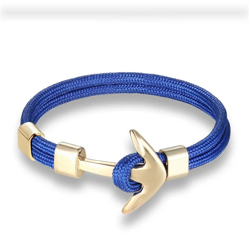  A vibrant blue rope bracelet adorned with a sleek anchor, ideal for adding a touch of maritime flair to any outfit.