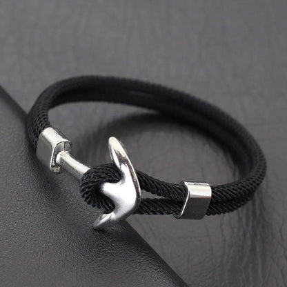 A stylish black and silver anchor bracelet featuring a sleek silver clasp, perfect for nautical-themed accessories.