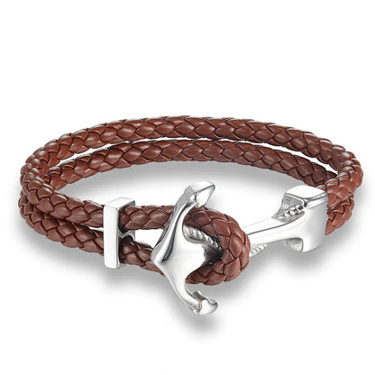 A stylish brown leather bracelet featuring a decorative anchor charm, perfect for nautical-themed accessories.