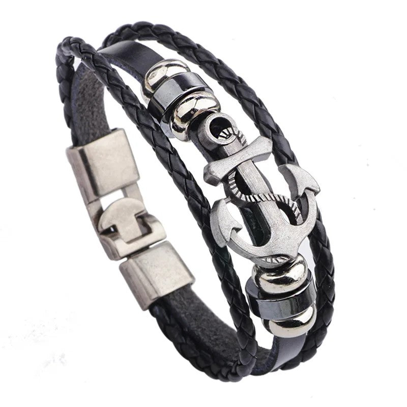 A stylish black leather bracelet featuring a silver clasp and an anchor charm, perfect for nautical-themed accessories.