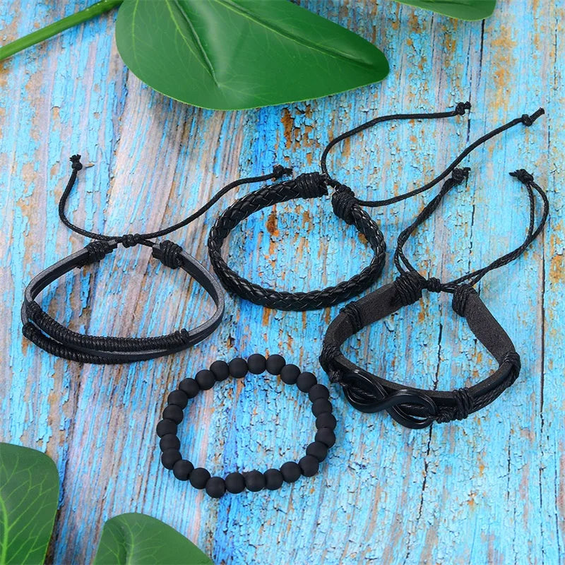 Four distinct bracelets displayed on a wooden table, showcasing various styles and materials in an elegant arrangement.