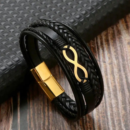 Stylish infinity bracelet made of black leather adorned with gold-plated brass, embodying everlasting bonds and elegance.