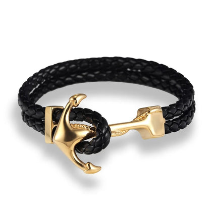  Black leather anchor bracelet featuring chic gold-plated brass details for a trendy look.