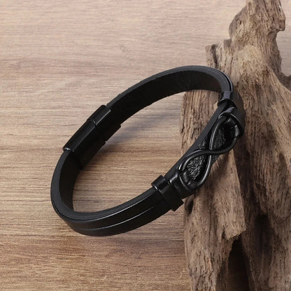 Stylish black leather bracelet with a prominent infinity symbol, embodying the concept of infinity and timelessness