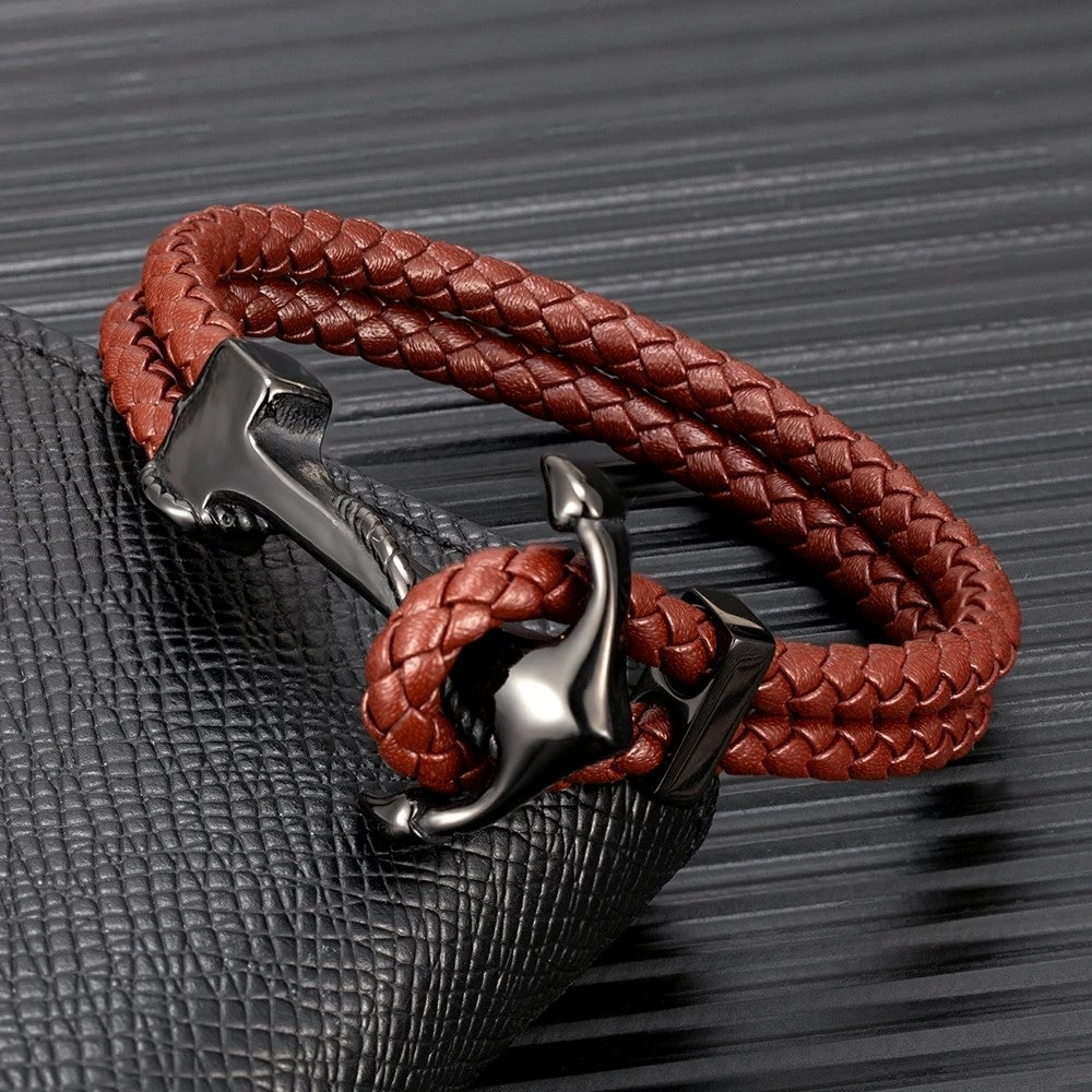 A stylish leather bracelet featuring a sleek black anchor, perfect for adding a nautical touch to any outfit.