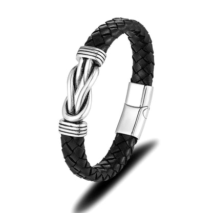  A black leather infinity bracelet featuring a sleek silver clasp, showcasing elegance and timeless style.