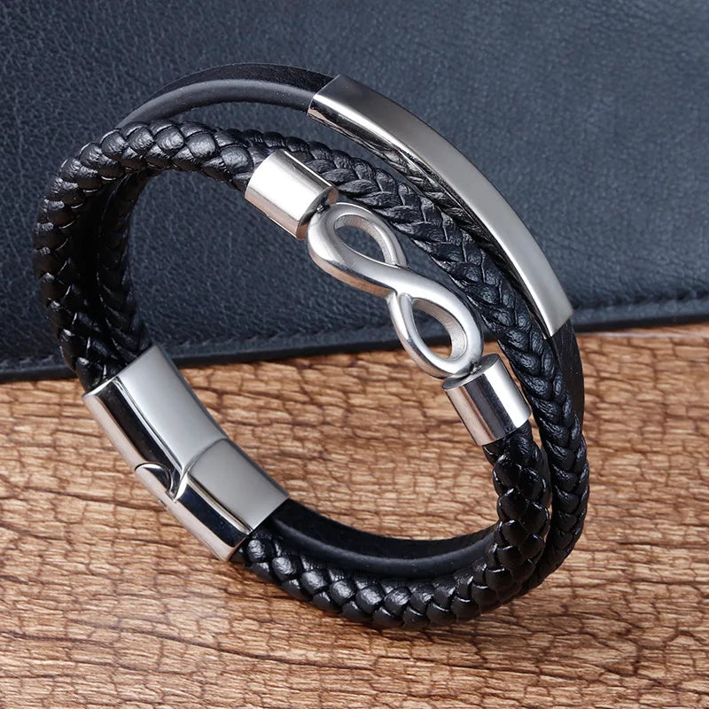 Elegant black leather infinity bracelet with a silver clasp, representing timelessness and sophistication in design.