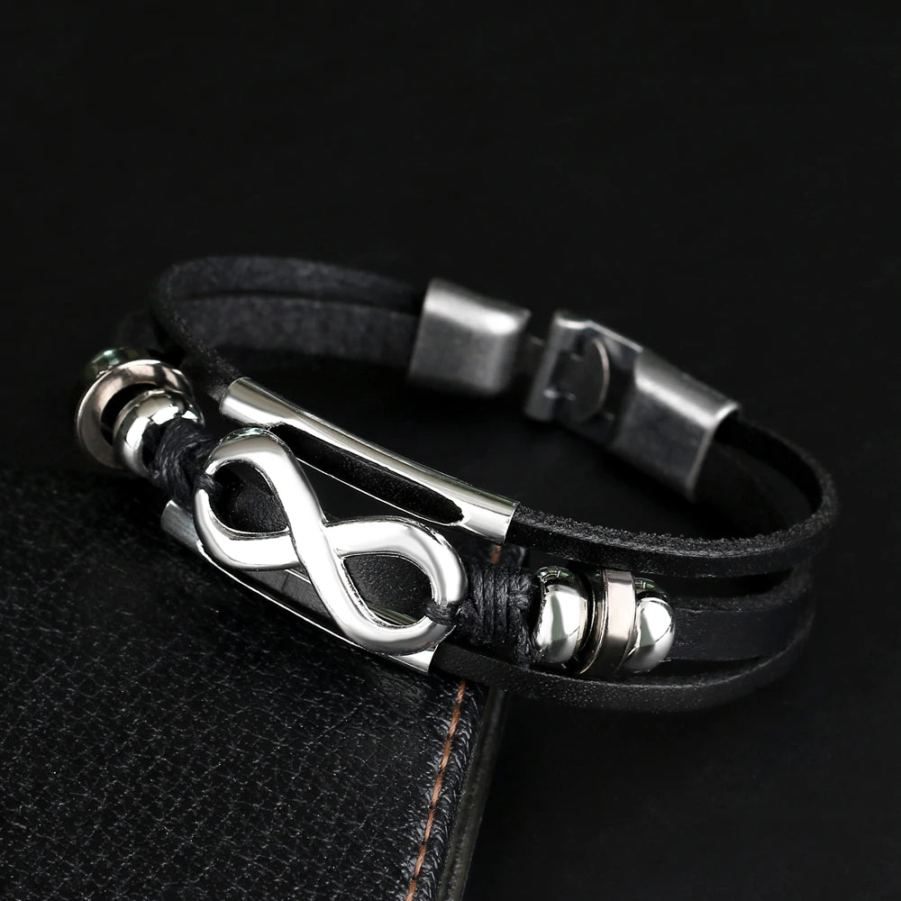 Stylish black leather bracelet with a prominent infinity symbol, embodying the concept of infinity and timelessness