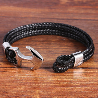 A trendy black leather bracelet showcasing a shiny silver anchor, ideal for adding a nautical flair to any outfit.