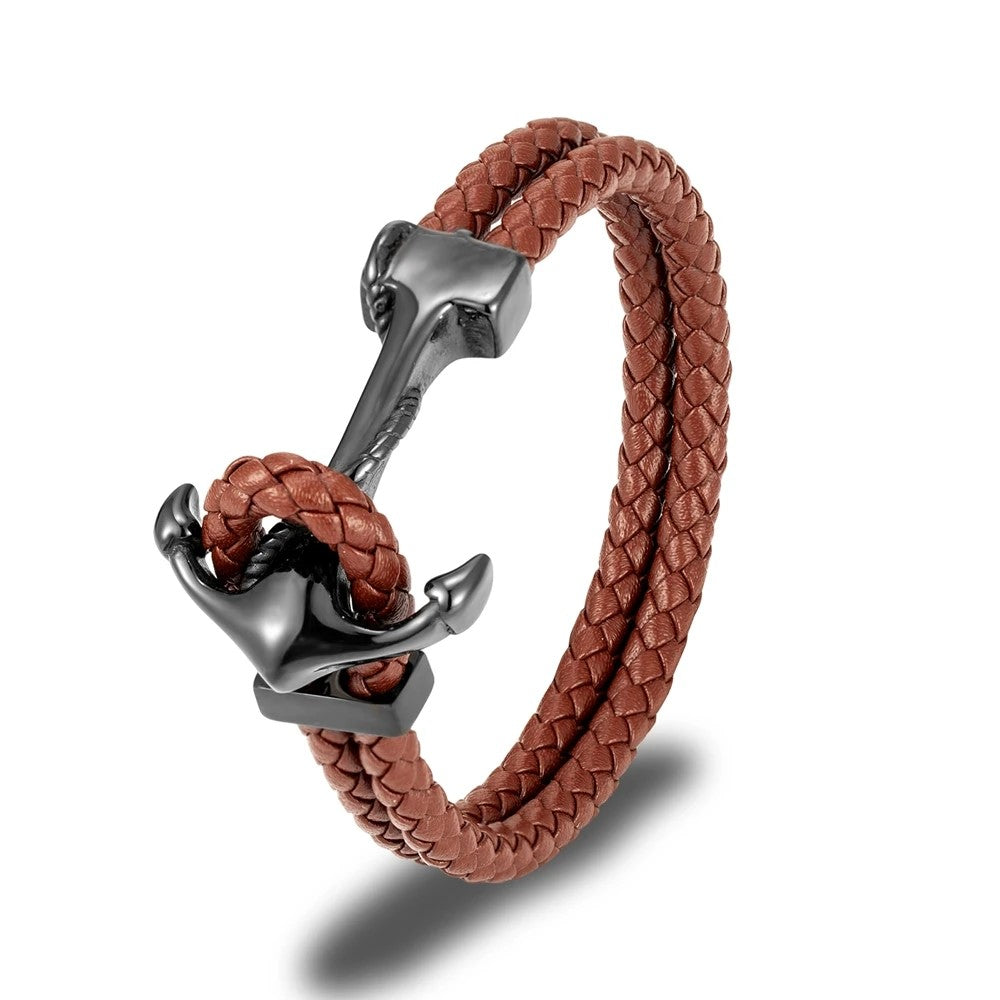 A chic anchor bracelet made of brown leather, perfect for adding a touch of nautical flair to any outfit.