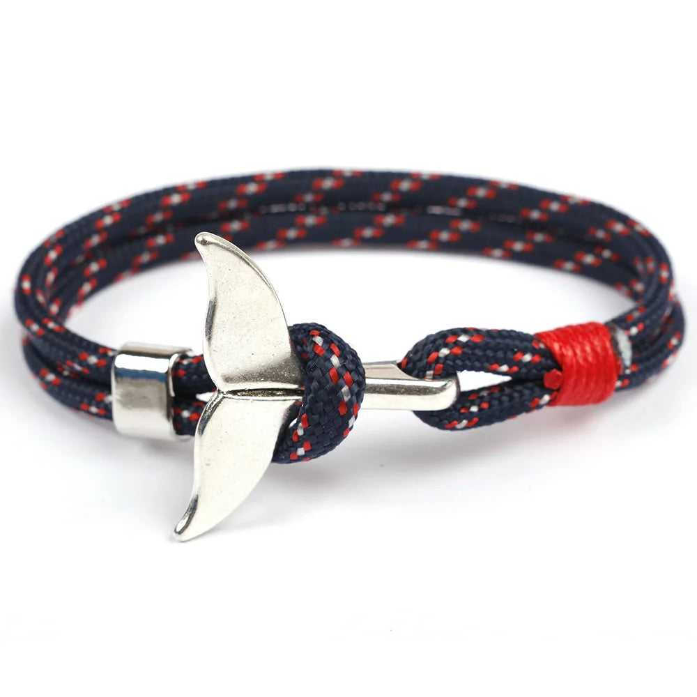 Navy blue rope bracelet featuring a sleek silver anchor charm, perfect for nautical-themed accessories.