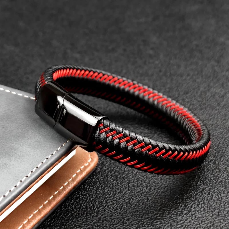 A fashionable braided leather bracelet in black and red, featuring a unique design that adds a touch of elegance.