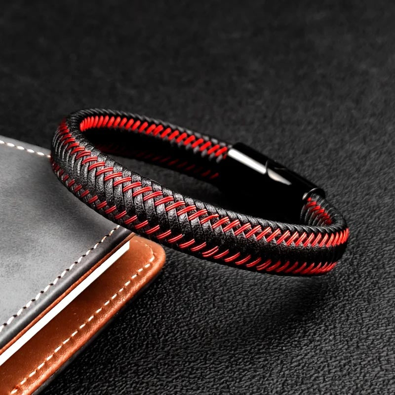 A fashionable braided leather bracelet in black and red, featuring a unique design that adds a touch of elegance.