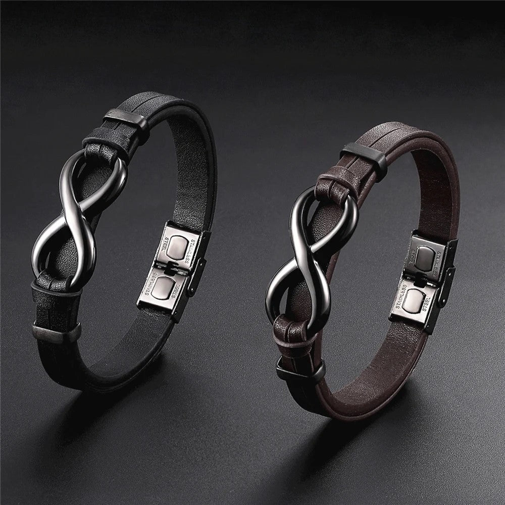 Two distinct leather bracelets featuring an infinity symbol, showcasing unique styles and craftsmanship.