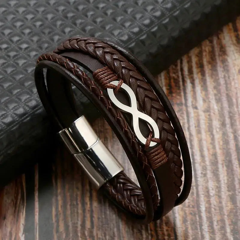 A leather infinity bracelet featuring a sleek silver clasp, symbolizing eternal connection and style.