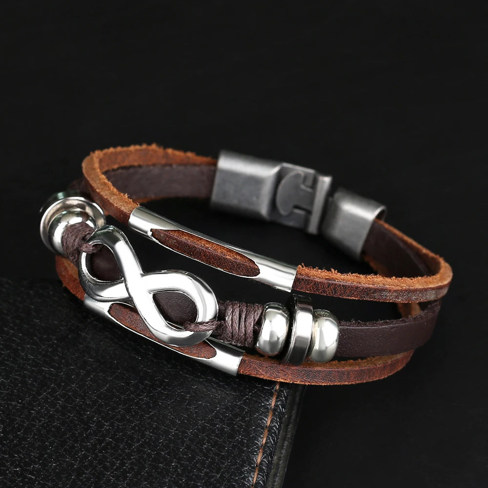 A brown leather infinity bracelet featuring two elegant metal beads, symbolizing endless love and connection