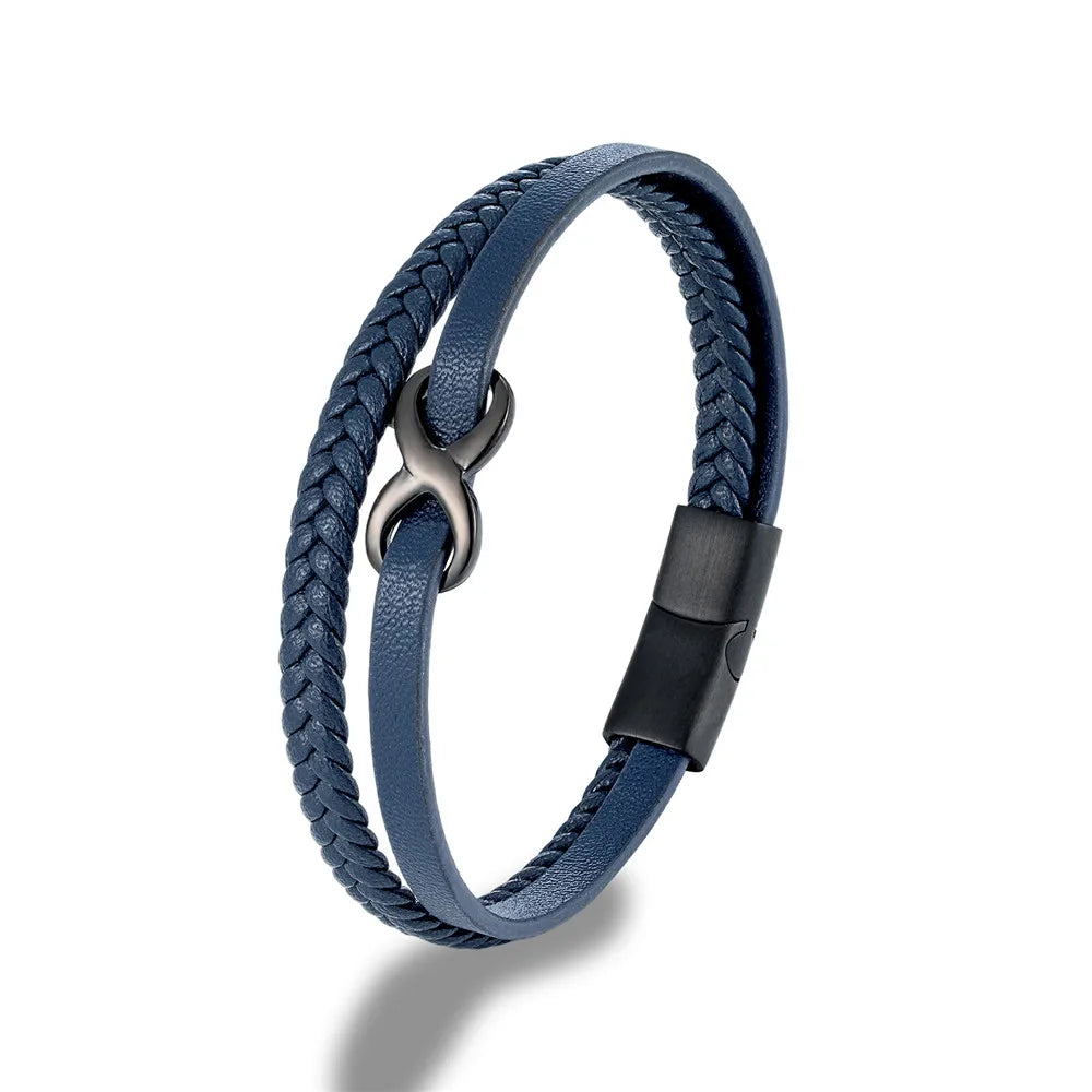 A blue leather bracelet with a black clasp, prominently displaying an Infinity Knot embellishment on the top