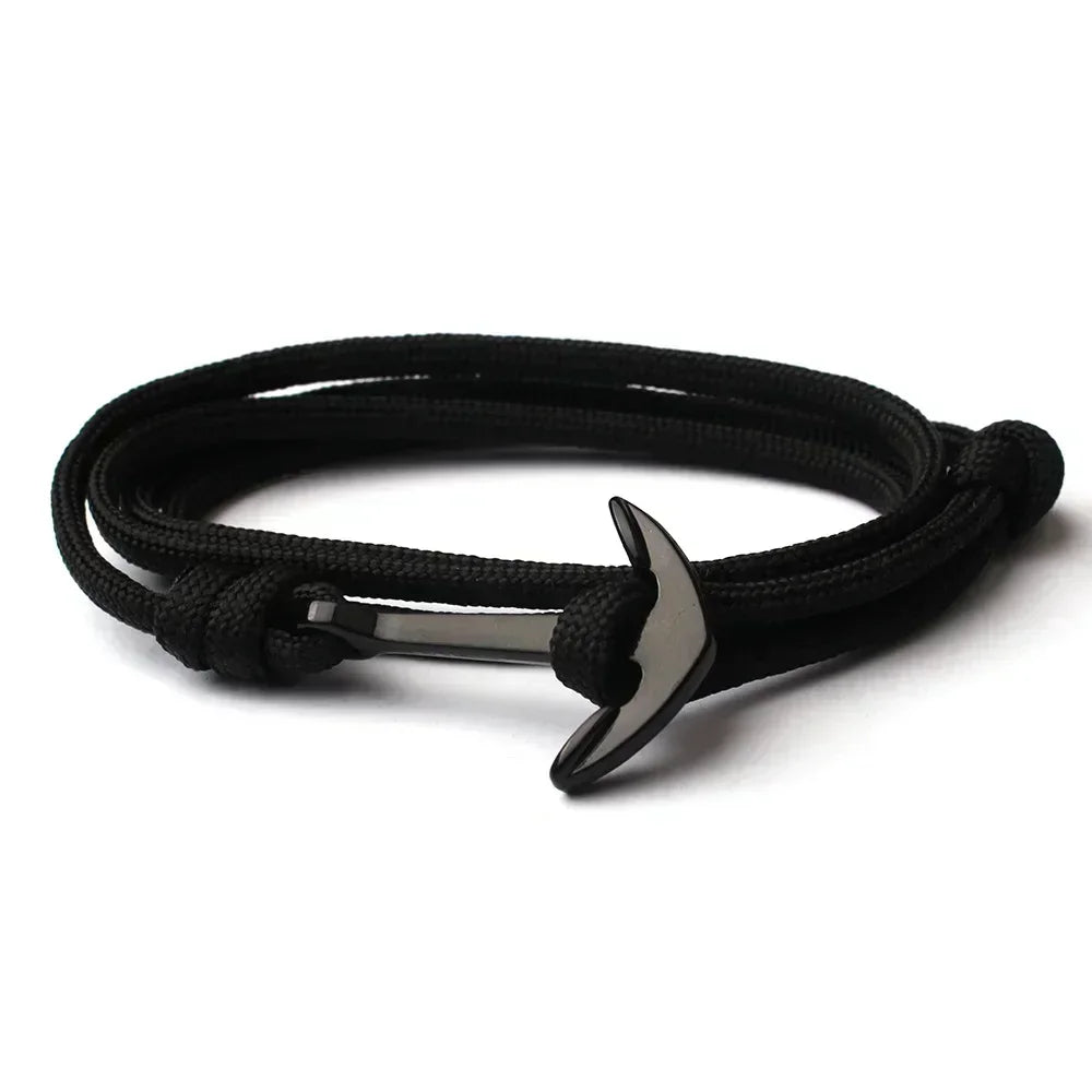 A fashionable black anchor bracelet on a black cord, combining simplicity and style for a versatile look.