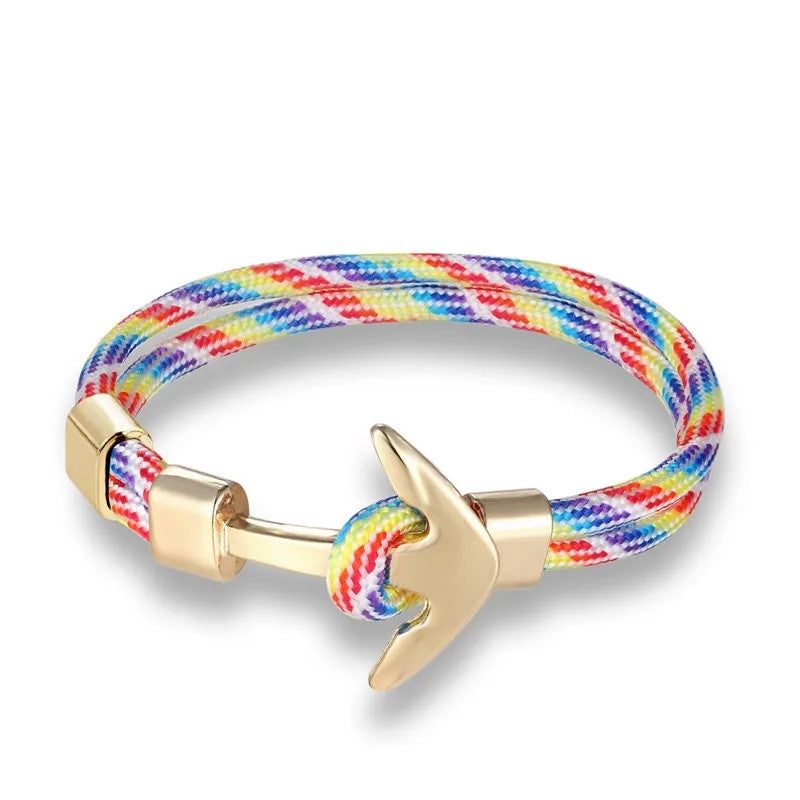 A colorful rope bracelet in rainbow hues, adorned with a sleek anchor, symbolizing adventure and style.