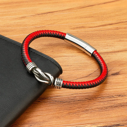 A stylish red and black bracelet featuring a sleek silver clasp, perfect for adding a touch of elegance to any outfit.