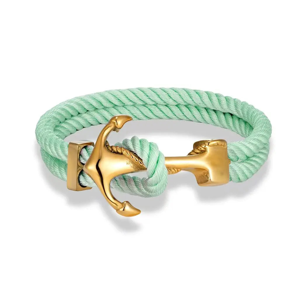 An anchor bracelet crafted from green rope and adorned with gold-plated brass accents.