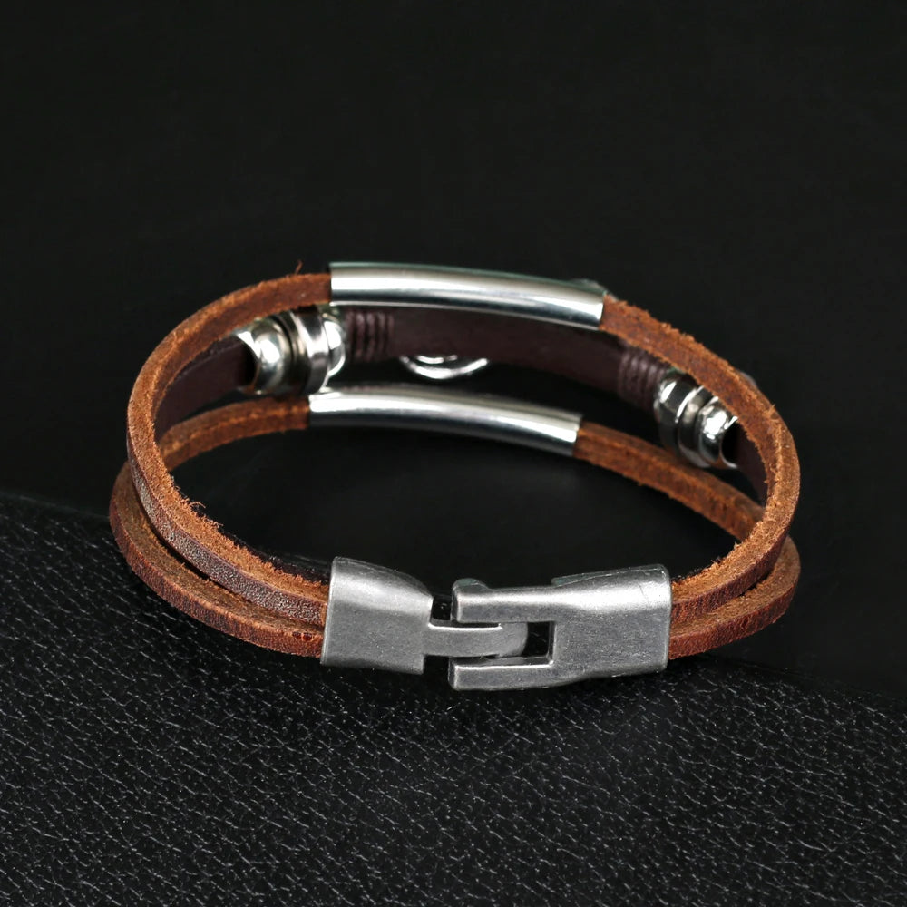 An infinity bracelet crafted from brown leather, adorned with two metal beads, representing eternal bonds and unity