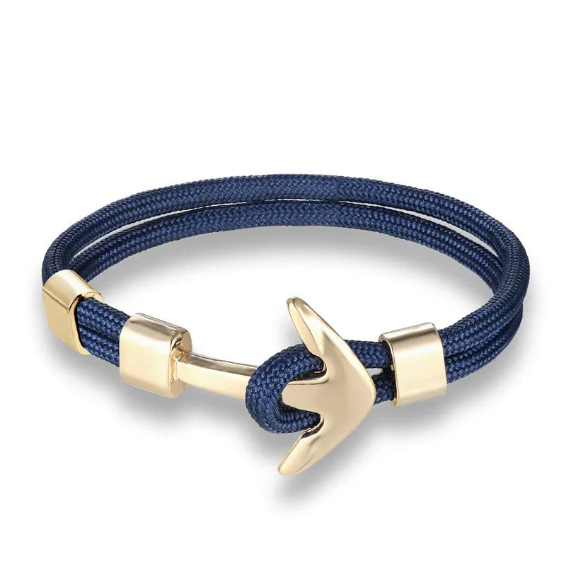  A stylish dip blue rope bracelet featuring a silver anchor charm, perfect for nautical-themed accessories.