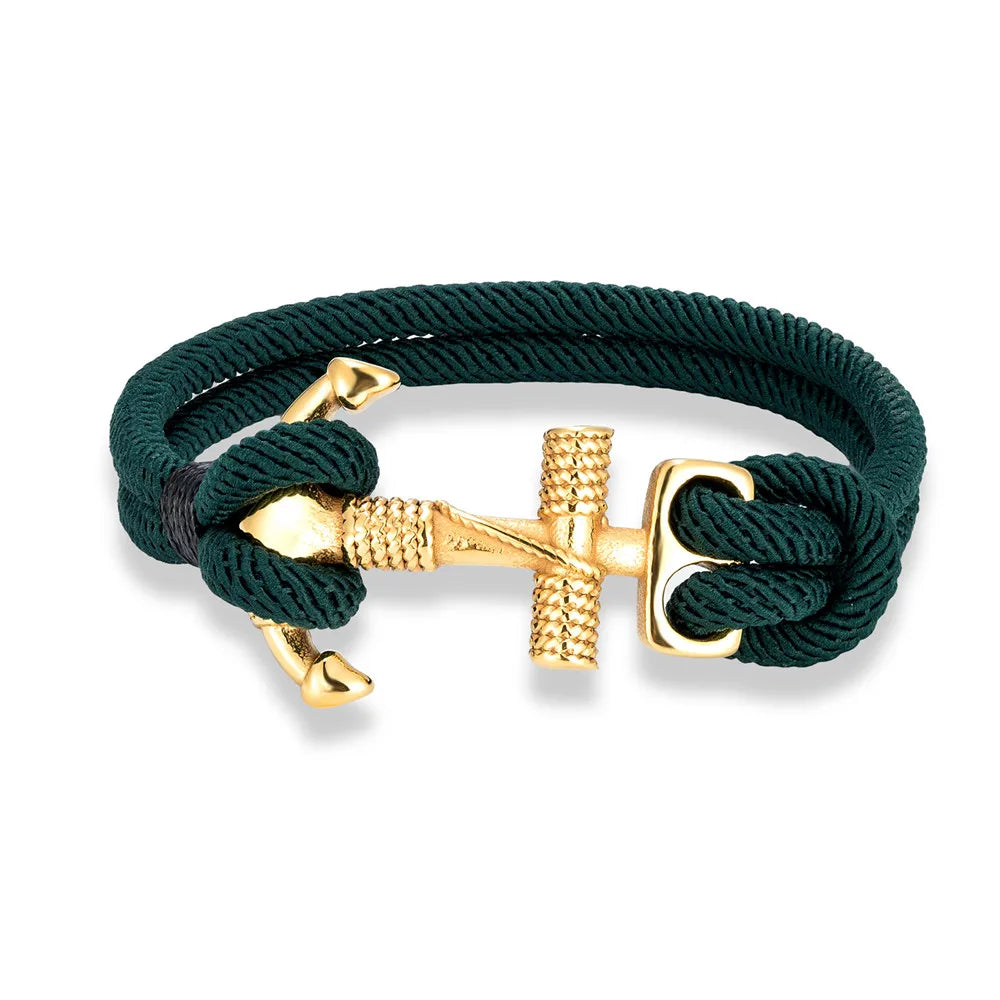 A gold plated stainless steel anchor charm bracelet with a red double strand nautical surfer rope.