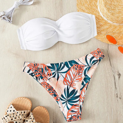 White bikini top and tropical leaf patterned bottom 