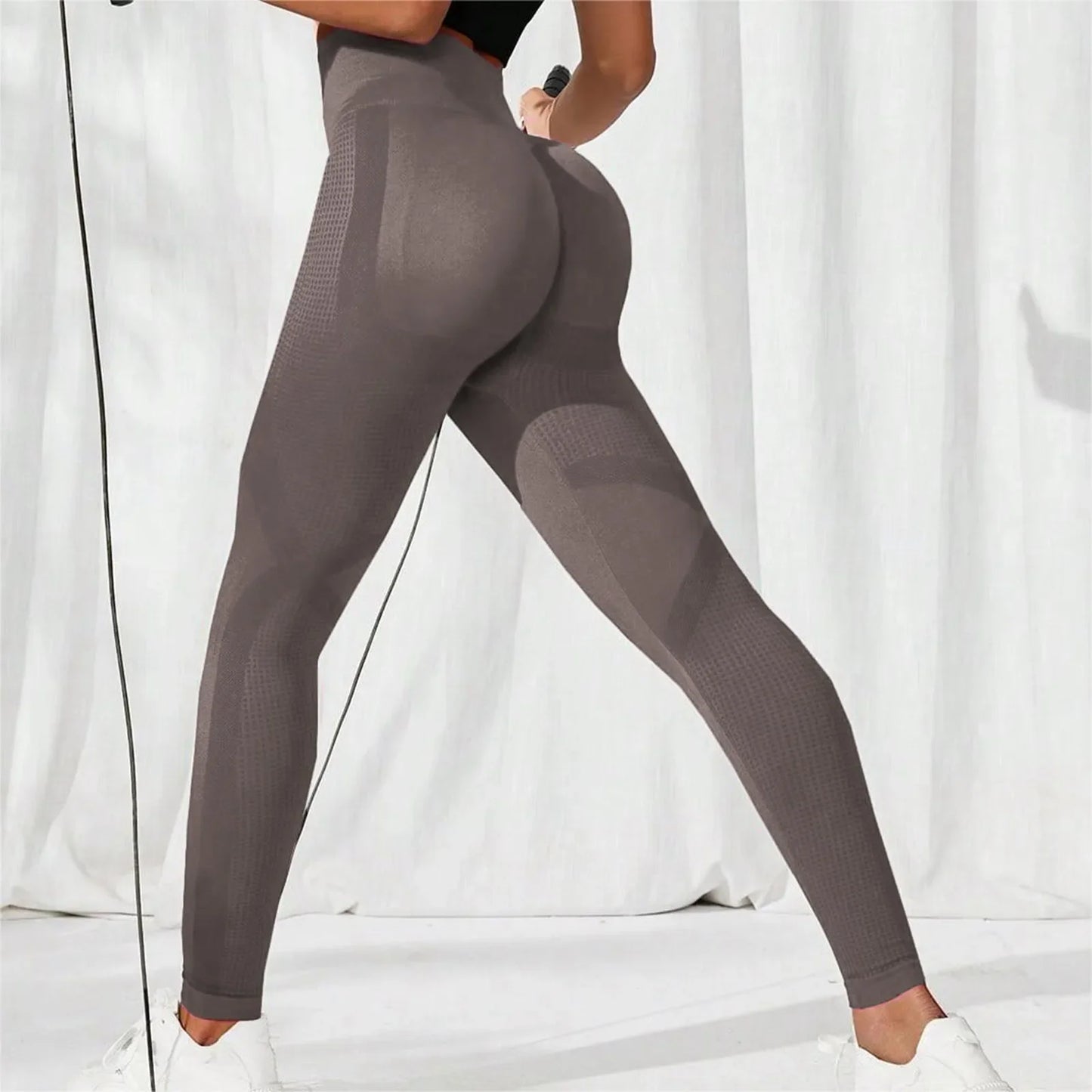 Person wearing gray leggings