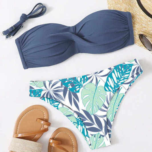 Blue bandeau bikini top and leaf-patterned shorts 