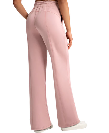 Pink wide-leg pants worn by a person on a white background