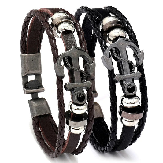 Two stylish leather bracelets featuring an anchor design and a sleek metal clasp, perfect for nautical-themed accessories.