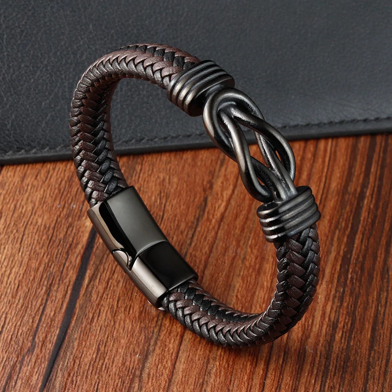 A stylish black brown leather bracelet with a black metal clasp, exemplifying elegance and contemporary fashion.