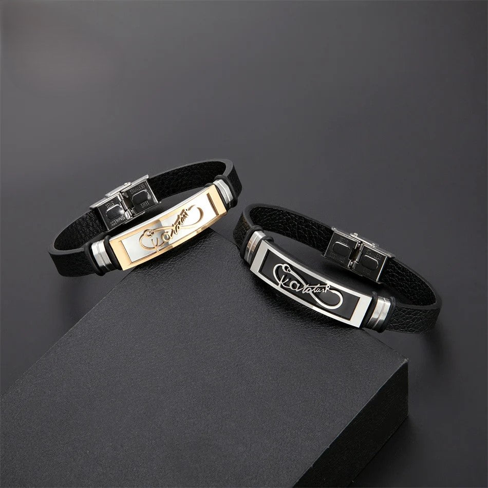  Two elegant black and gold bracelets featuring a charming heart design, showcasing a stylish and sophisticated accessory.